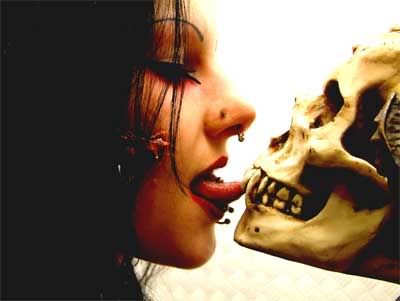 Woman licks skull