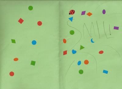 Inside of card. Says S M I L ! with more colored stickers of shapes, and one ladybug sticker.