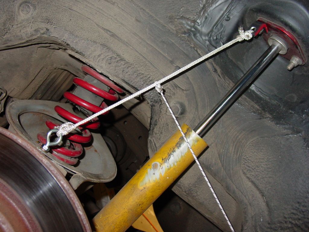 rear spring falls out at full droop on e36, whats good fix?